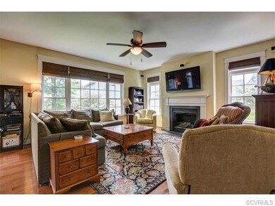 Family Room with gas fireplace, hardwood floors, B