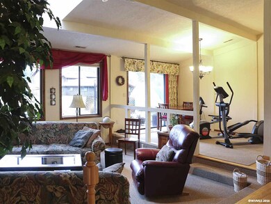 Dining room overlooks the step down living room, p