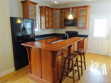 Cherry cabinetry and island