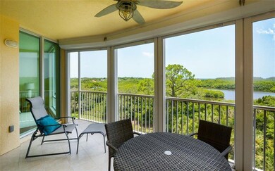 Large screened-in balcony with hurricane shutters.