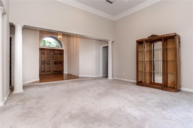 View of foyer from back of living room.  Furniture will not convey.