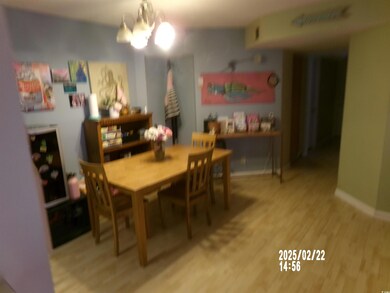 Dining space with baseboards, a chandelier, and wo