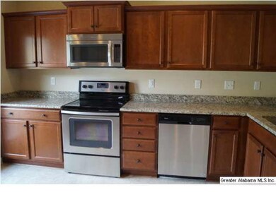 Kitchen with granite countertops and stainless app
