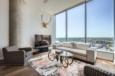 Living room with wood finished floors and a wall 