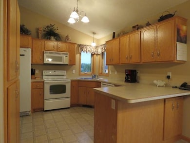 Spacious kitchen with snack bar, oak cabinets, lar