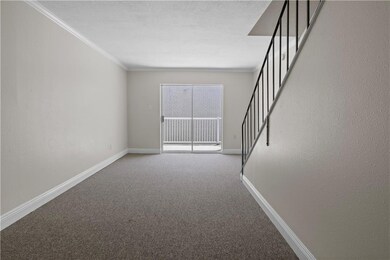 Living area & entry way to patio.