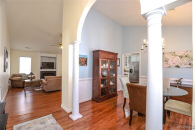 Dining area featuring hardwood flooring and TV