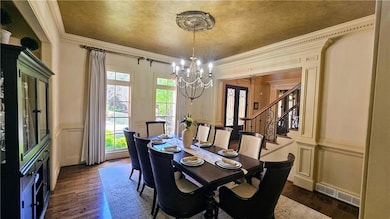 Dining area featuring a decorative wall, visible v