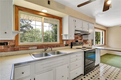 The kitchen overlooks your private backyard...