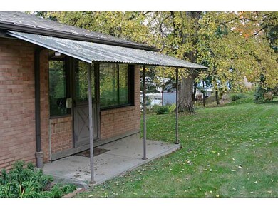 Sunroom. Outside view of sunporch door and awning.