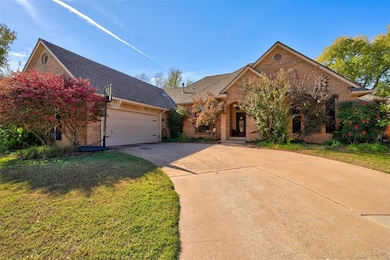 View of front of house with a garage and a front y