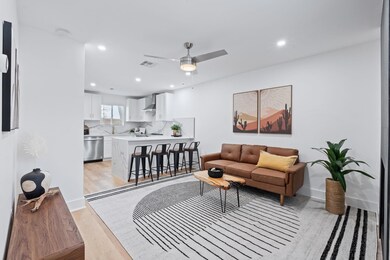 Living area with visible vents, ceiling fan, rece
