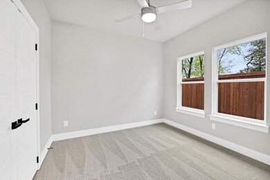 Unfurnished room with light colored carpet and cei