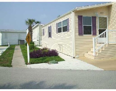 Exterior Back. There is a patio, small porch & sto