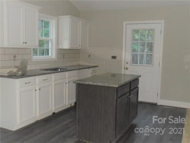 Granite tops, subway tile backsplash, LVP flooring