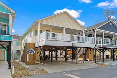 View of front of property with covered porch, a ca