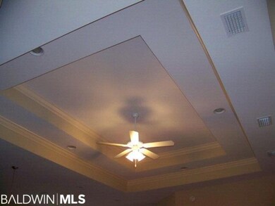 Trey ceiling with recessed lighting in living area
