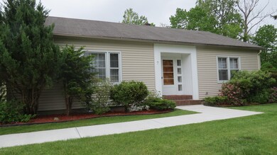 Front with newer concrete sidewalk