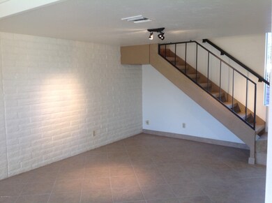 DINING AREA WITH STAIRS TO LOFT