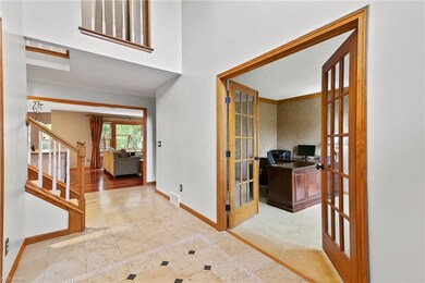 Foyer leading into kitchen and family room