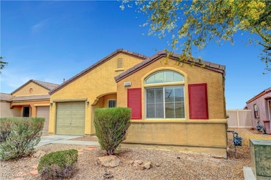 View of front of house with stucco siding, fence,