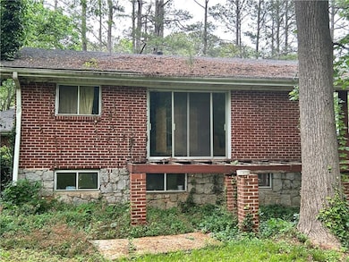 View of property exterior with brick siding