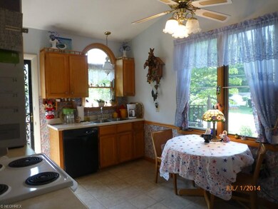 The kitchen has ceramic floors, updated cabinetry 