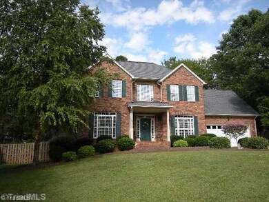 Exterior Front. Large yard with covered front porch. Located on street ending in cul-de-sac.