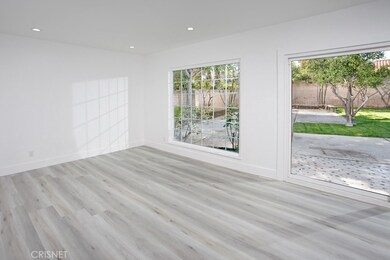 Dining Room - New light switches and outlets, New base moldings and New wood - grained luxury vinyl tile flooring.