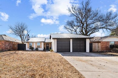 View of front of house with a garage and a porch