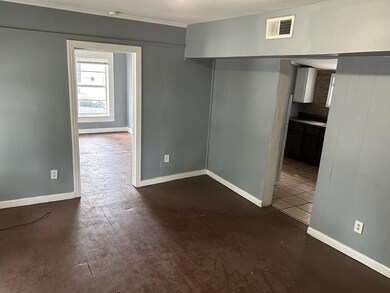 Empty room featuring dark hardwood / wood-style fl