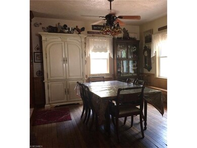 Dining room with black walnut wood flooring