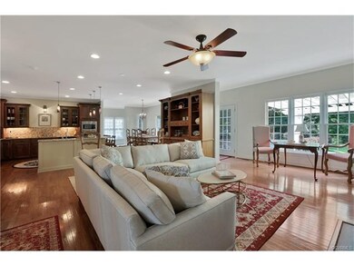 Family room is open to the kitchen and wall of win