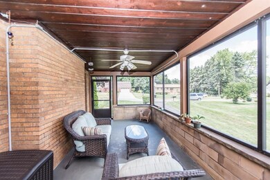 Step out of the living room onto the screened in s