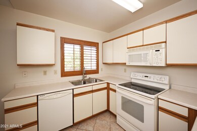 Kitchen w/white appliances.