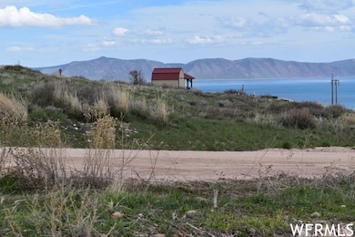 Property view of mountains with a water view