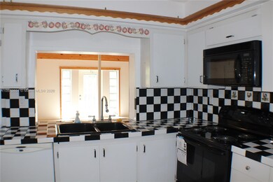 White and equipped kitchen