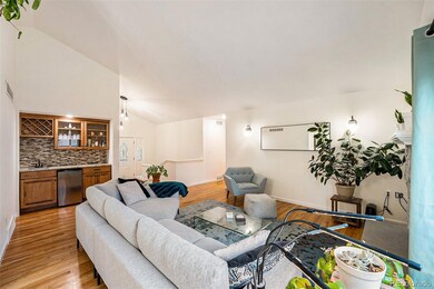 Living room - open floor plan to dining and bar ar