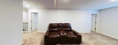 Living area with light carpet