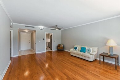 View of living area towards kitchen and main entra