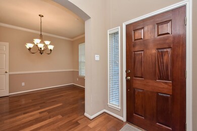 Beautiful front entry with arches and neutral colors