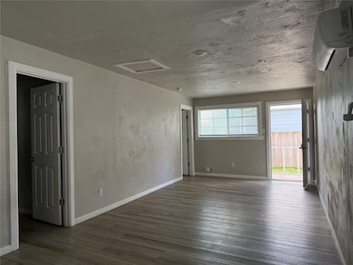 View of front door from kitchen area