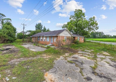 View of property exterior with brick siding