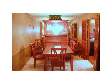 Dining Area. Mirrored wall visually expands the la
