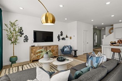 Living area with light wood finished floors, reces