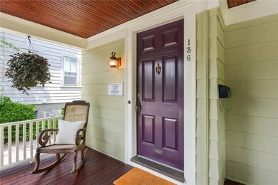 Front door from beautiful porch.