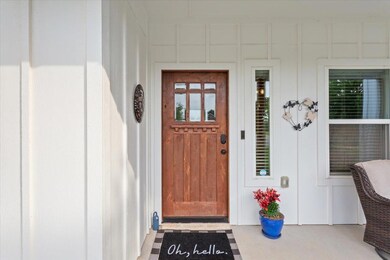 Doorway to property featuring board and batten si