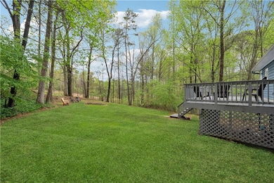 View of Back yard with a wooden deck