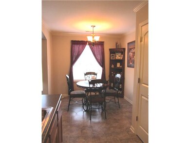 Dining area has large window overlooking the rear 