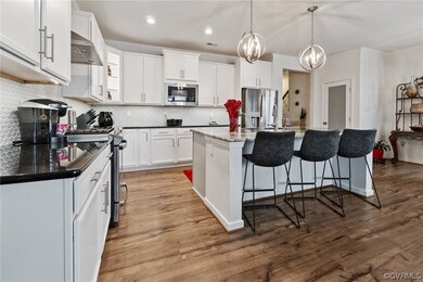 Kitchen featuring appliances with stainless steel